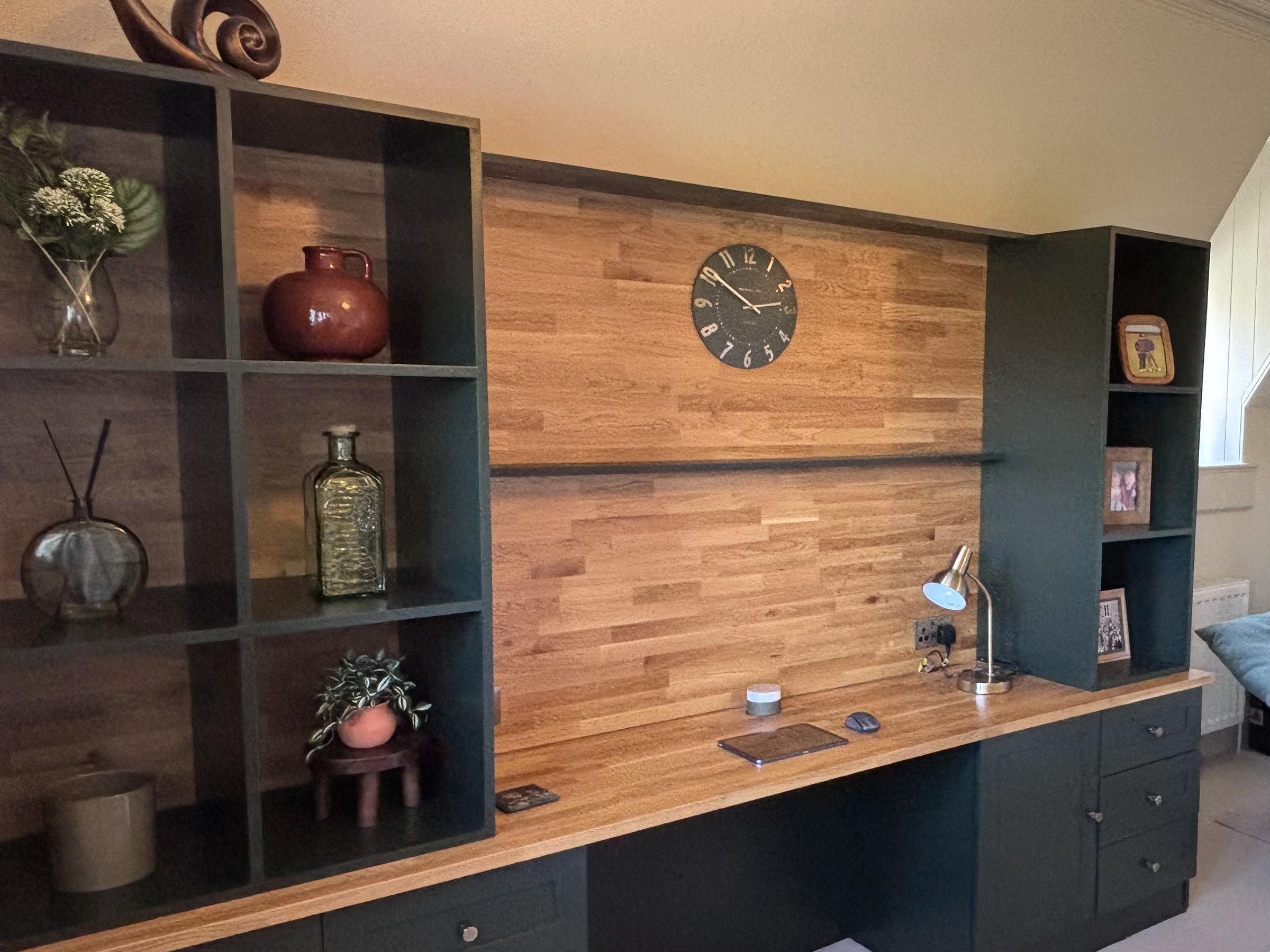 Built-in desk and shelving with timber wall panelling