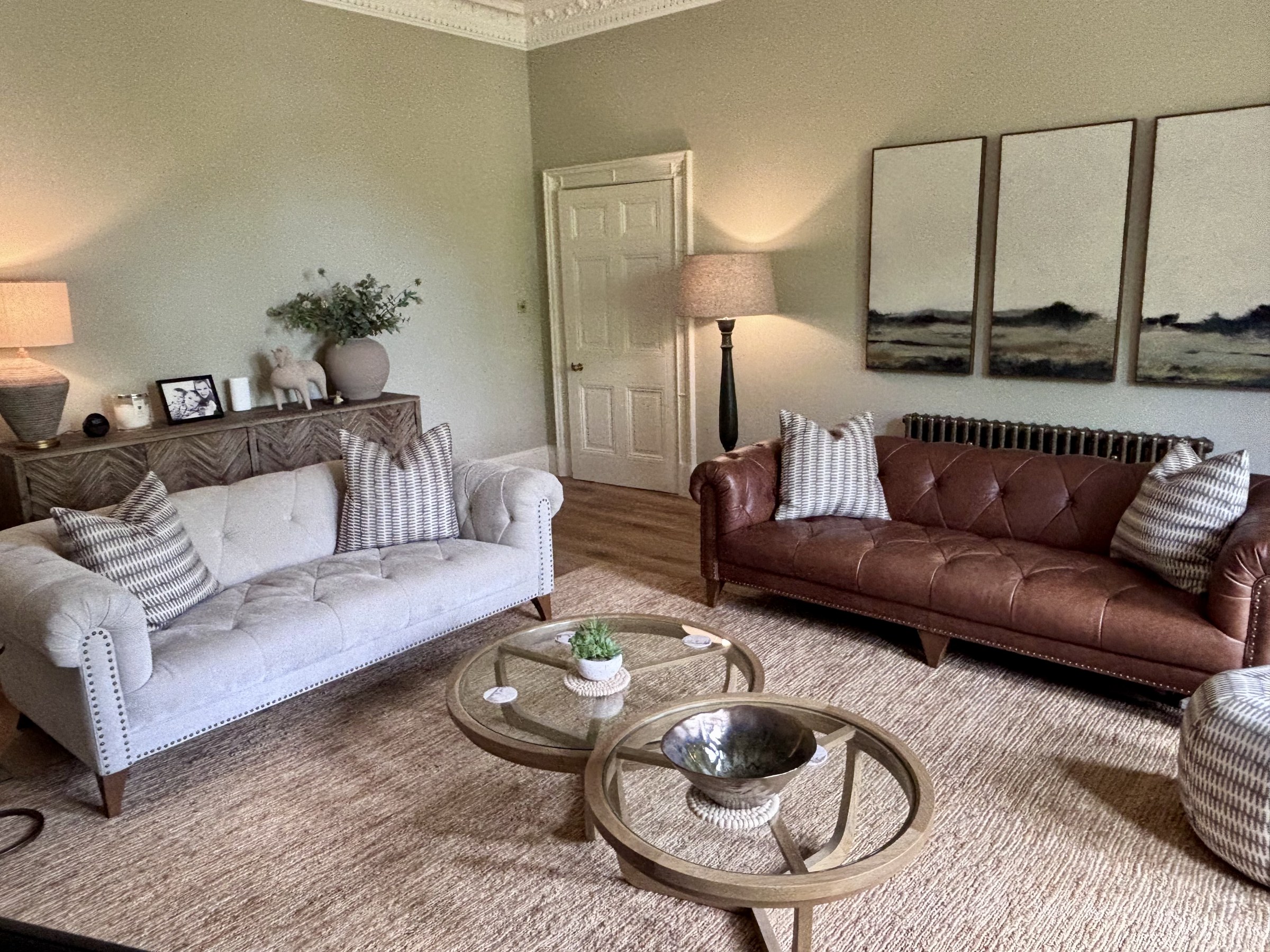 Living room seating with leather and upholstered sofas
